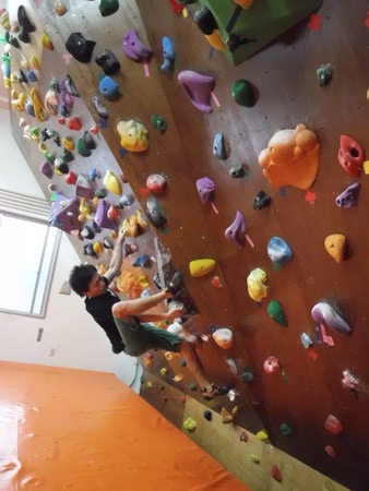 A climber at Koru Piki: Rock-Climbing Gym, Ginowan